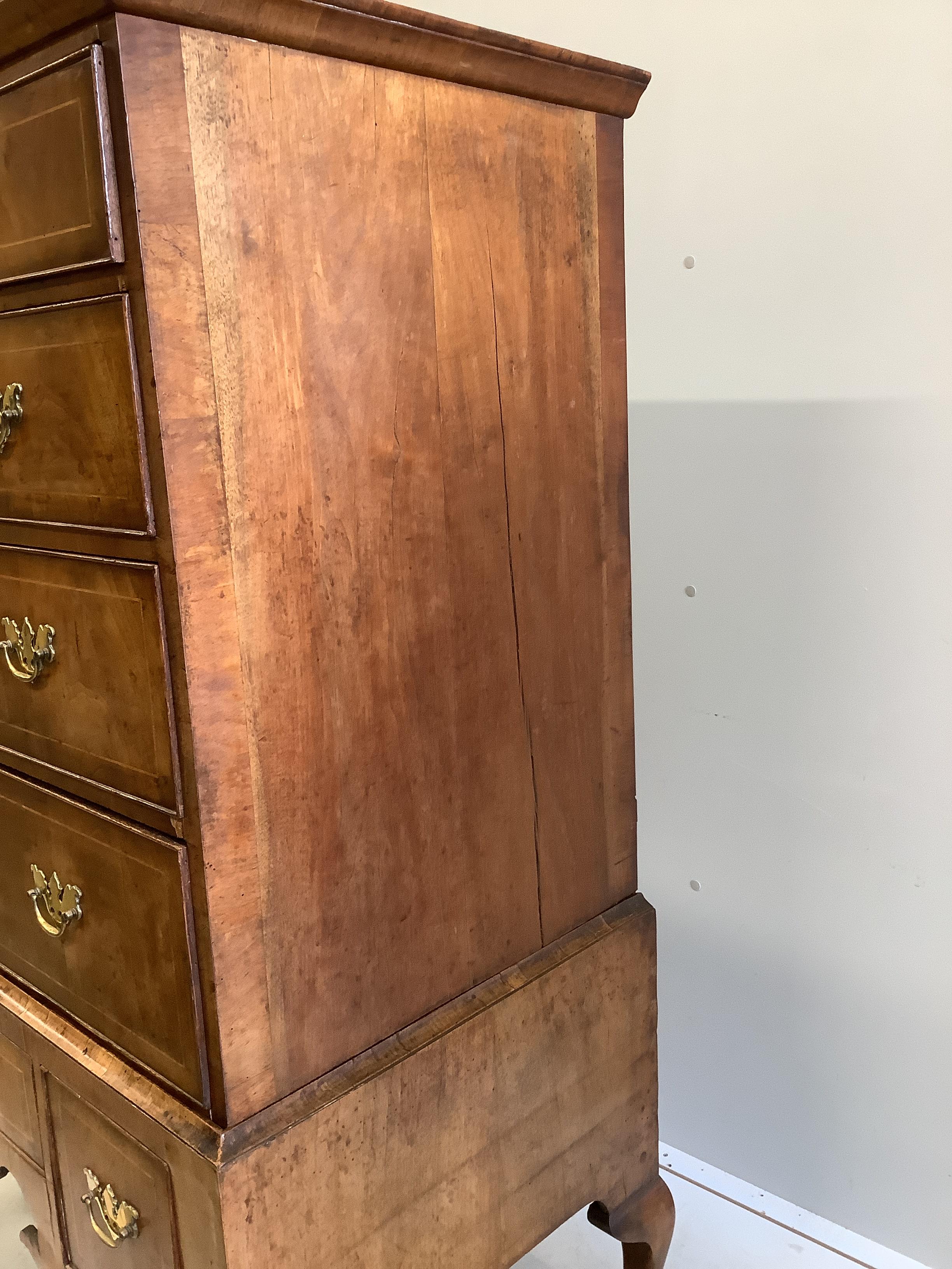 An 18th century walnut chest on stand, width 97cm, depth 56cm, height 146cm